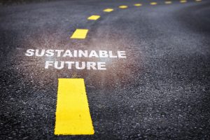 A road with sustainable future written on it