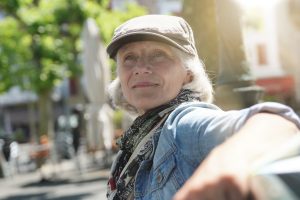 Retired, but young woman on a bench, enjoying life